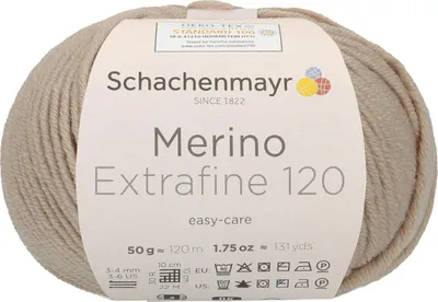 A ball of beige yarn with a label wrapped around it.