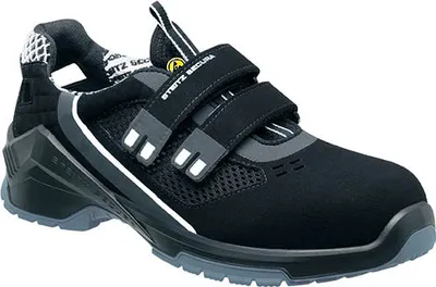 A single black safety shoe with gray and white accents is shown against a white background.