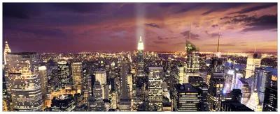 Produktbild von Wallario Wandbild aus Acryl, 125 x 50 cm, freischwebende Optik - New York bei Nacht - Panoramablick über die Stadt