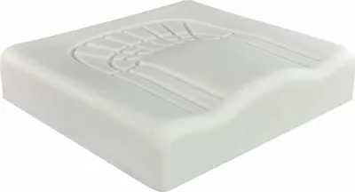 A white orthopedic seat cushion with an embossed pattern.