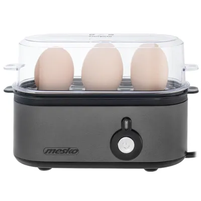 A Mesko egg cooker with three eggs inside, shown from the front.