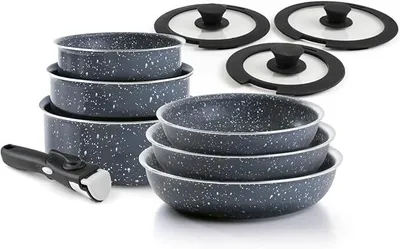 A set of cookware, including pots, pans, lids, and a detachable handle, arranged on a white background.