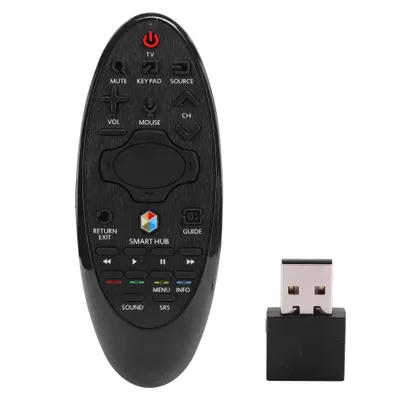 A black TV remote control and a USB dongle are shown against a white background.