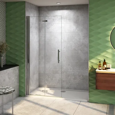 A modern bathroom with a walk-in shower, green textured walls, and a wooden vanity.