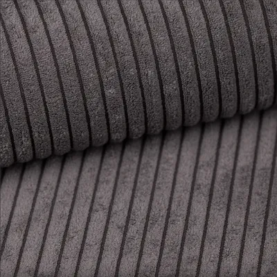 Close-up of corduroy fabric with vertical stripes.