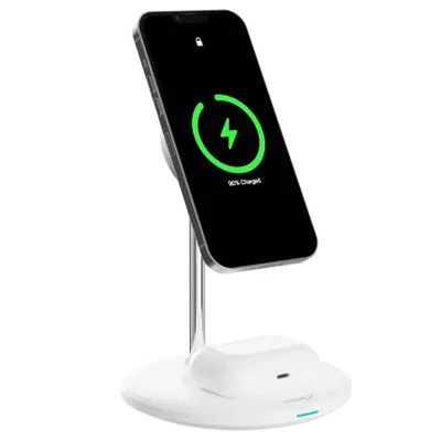 A white wireless charging stand with a smartphone and earbuds case on it.