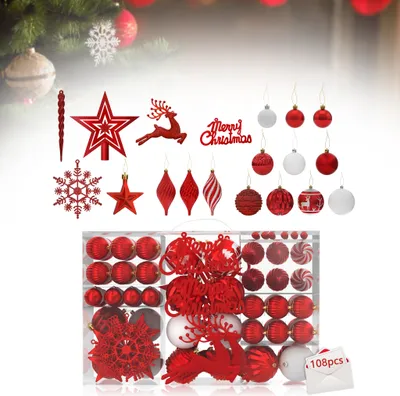 A collection of red and white Christmas ornaments displayed in a clear plastic box, with some individual ornaments and decorations arranged above the box.