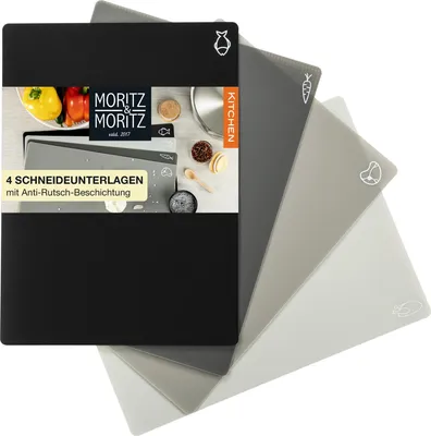 A set of four cutting mats with different food icons, fanned out.