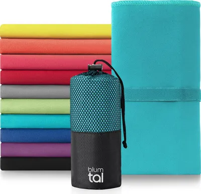 A stack of folded microfiber towels in various colors, with a rolled-up towel in a mesh bag in the foreground.