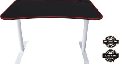 A white gaming desk with a black surface and red trim, shown from the front.