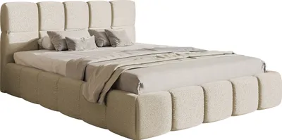 A bed with a headboard and frame upholstered in light beige chenille fabric, with pillows and a throw blanket on top.