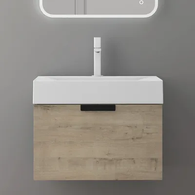 A modern bathroom vanity with a white sink and a wood-grain cabinet.