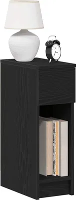 A black wooden nightstand with a drawer and an open shelf displaying books, topped with a white lamp and a black alarm clock.