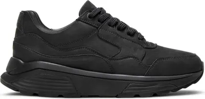 A black sneaker is shown from the side against a white background.