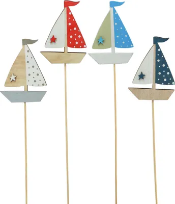 Four decorative wooden sailboat picks on white background.