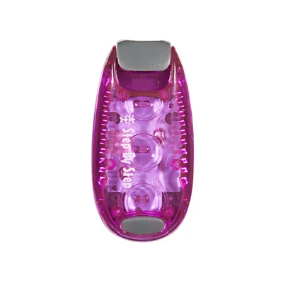 A close-up studio shot of a purple LED clip-on light.