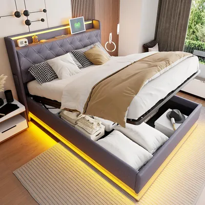 A modern bedroom with a bed that has storage underneath and LED lighting.