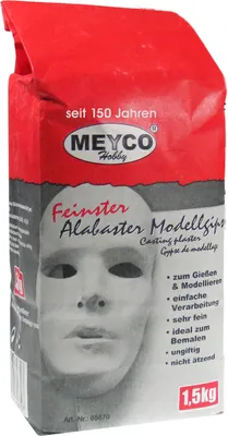 A bag of white modeling plaster with a depiction of a mask on the front.