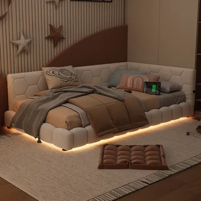 A corner daybed with ambient lighting and decorative pillows in a bedroom setting.