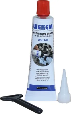 A tube of black silicone sealant with a red cap, a nozzle, and a black applicator tool.