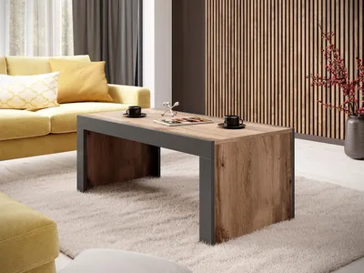 A modern living room with a yellow sofa and a wooden coffee table.