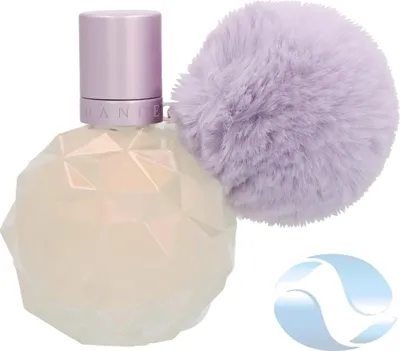 A perfume bottle with a fluffy pom-pom attached.