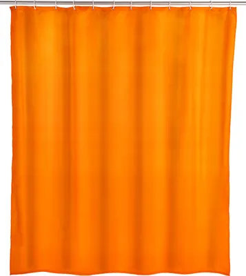 A plain orange shower curtain hanging from a shower rod.