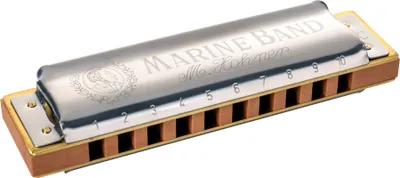 A Hohner Marine Band harmonica is shown from a diagonal angle against a white background.