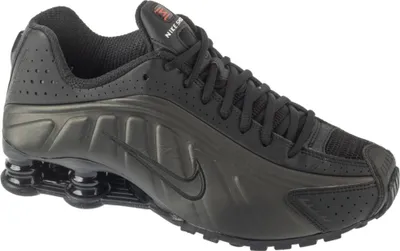 A studio shot of a single Nike Shox R4 sneaker.