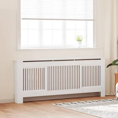 A white MDF radiator cover is placed in front of a window with blinds.
