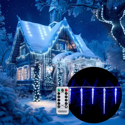 A snowy house decorated with blue LED icicle lights for Christmas.