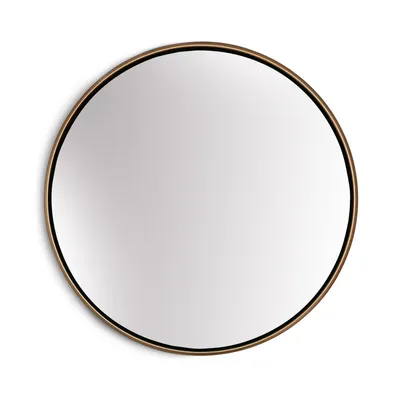 A round mirror with a gold frame on a white background.