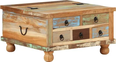A close-up studio shot of a multi-colored, rustic wooden coffee table with storage drawers and a lift-top.