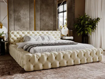 A luxurious tufted bed in a bedroom setting with draped curtains and a large plant.