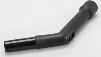 A black vacuum cleaner attachment is shown against a white background.