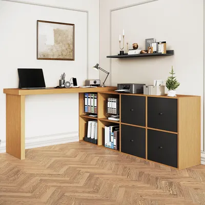 A corner desk with storage compartments and a laptop on it.