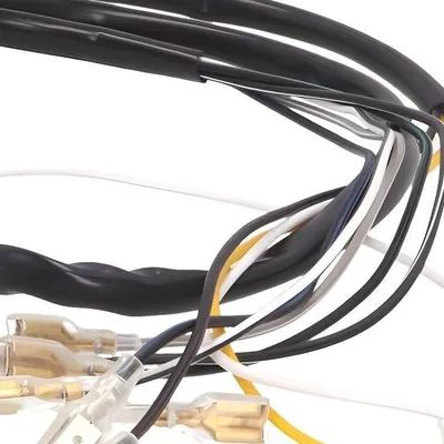 A close-up view of a complex wiring harness with multiple colored wires and connectors.