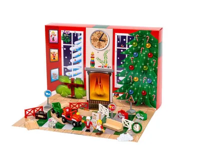 A Christmas-themed advent calendar playset with a train set, fireplace, and Christmas tree.