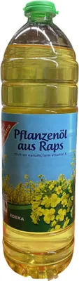 A bottle of cooking oil with a label showing rapeseed flowers.