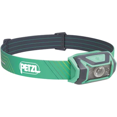 A product shot of a green and gray Petzl headlamp on a white background.