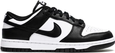 A studio shot of a Nike Dunk Low Retro sneaker in black and white.