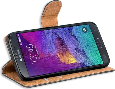 A black Samsung Galaxy Note 4 smartphone in a brown flip case, displayed on a white background.