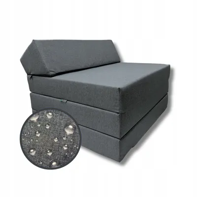 A gray foldable mattress with a triangular headrest, displayed on a white background. A circular inset shows water droplets on the fabric, indicating its waterproof nature.