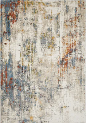 A close-up, abstract view of a rug with distressed patterns.