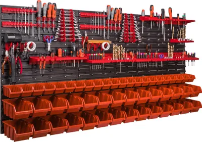 A wall-mounted tool organizer with numerous tools and storage bins.
