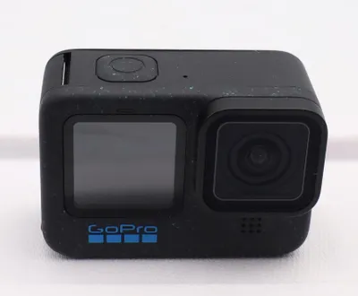 A black GoPro action camera is shown from the front on a white background.