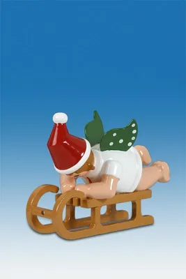 Zdjęcie produktu dla Drewniana figurka anioła leżącego na sankach z czapką, wysokość 6 cm, NOWA