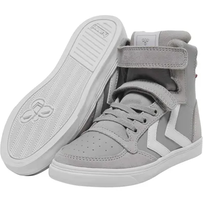 A pair of high-top sneakers shown from a diagonal angle, with one shoe placed on top of the other, revealing the sole of the bottom shoe.