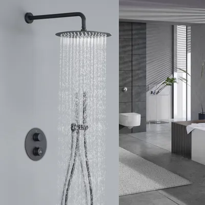 A modern bathroom with a black shower system in operation.