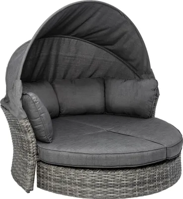 A round outdoor daybed with a canopy and cushions.